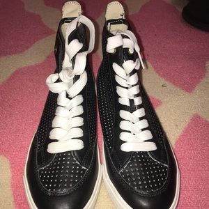 Black high top sneakers